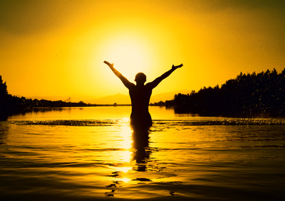 confidence, person in water silloetted against a sunset